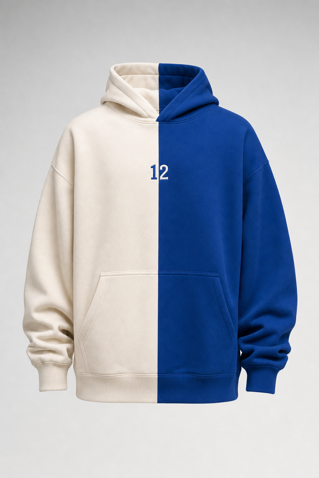 Split-color hoodie, half cream half Savoy blue, with an embroidered 12 on the centre line